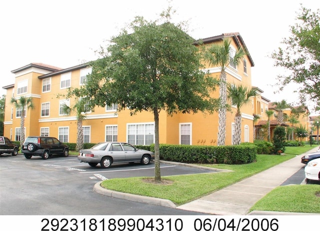 5459 Vineland Rd Unit 4310, Orlando, FL 32811 - view of property featuring uncovered parking