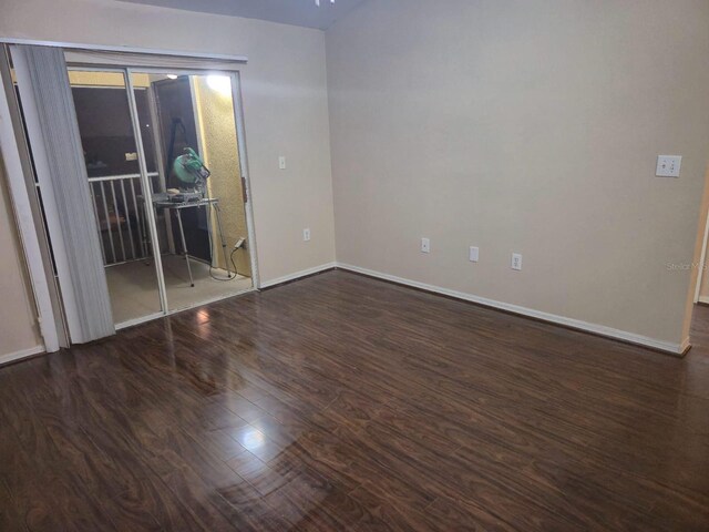 5459 Vineland Rd Unit 4310, Orlando, FL 32811 - spare room with wood finished floors and baseboards