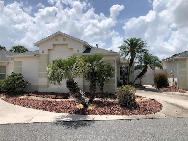 1524 Conway Ct, The Villages, FL 32162 - view of front of property with stucco siding, a garage, driveway, and a shingled roof
