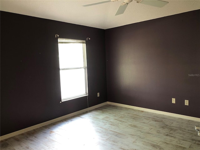 1524 Conway Ct, The Villages, FL 32162 - empty room with a ceiling fan, wood finished floors, and baseboards