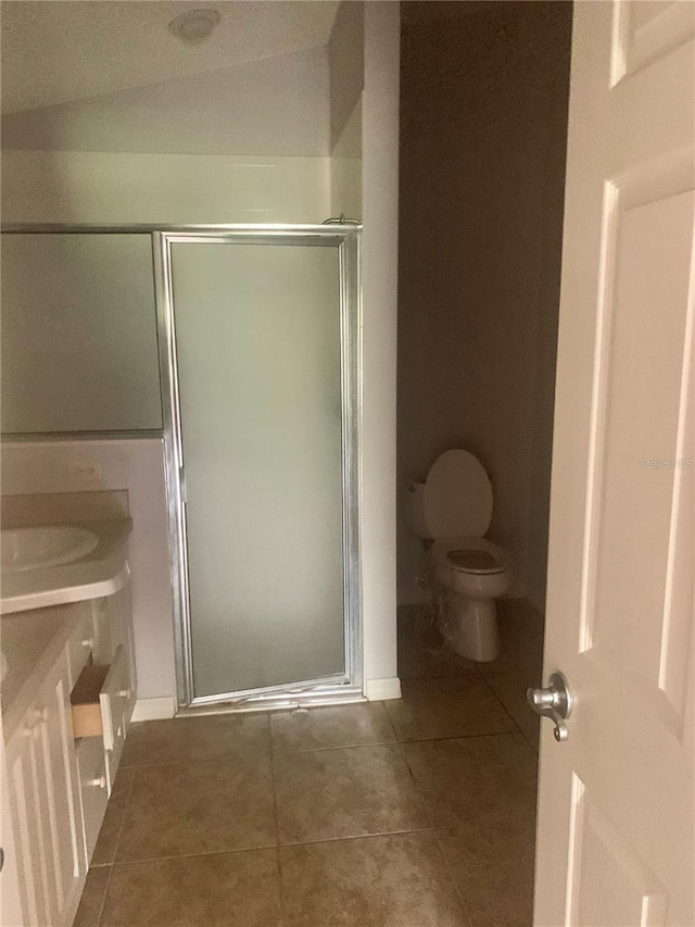 1524 Conway Ct, The Villages, FL 32162 - full bathroom with toilet, tile patterned flooring, a shower stall, and vanity