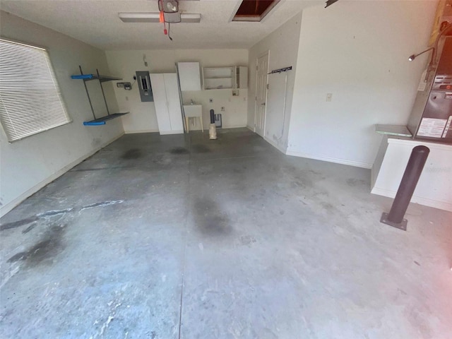 1524 Conway Ct, The Villages, FL 32162 - garage featuring electric panel, ceiling fan, a garage door opener, and a sink