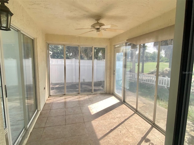 1524 Conway Ct, The Villages, FL 32162 - unfurnished sunroom featuring a ceiling fan