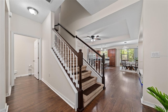 3508 Brighton Park Cir, Belle Isle, FL 32812 - stairs with ceiling fan, wood finished floors, and baseboards
