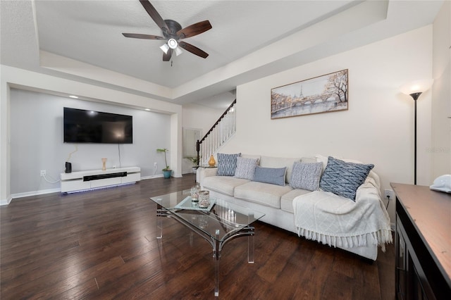 3508 Brighton Park Cir, Belle Isle, FL 32812 - living area featuring a tray ceiling, ceiling fan, stairs, and wood finished floors