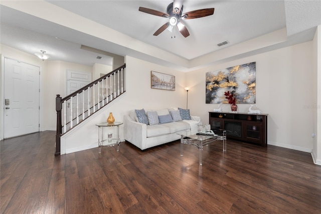 3508 Brighton Park Cir, Belle Isle, FL 32812 - living area with wood finished floors, stairway, ceiling fan, baseboards, and a raised ceiling