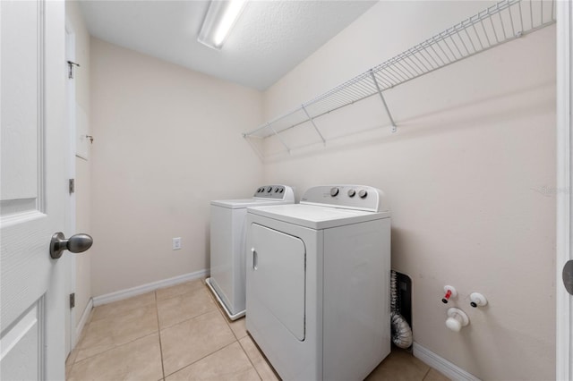 3508 Brighton Park Cir, Belle Isle, FL 32812 - washroom with washing machine and dryer, baseboards, and light tile patterned floors