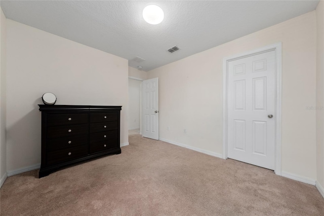 3508 Brighton Park Cir, Belle Isle, FL 32812 - unfurnished bedroom with carpet floors, baseboards, and a textured ceiling