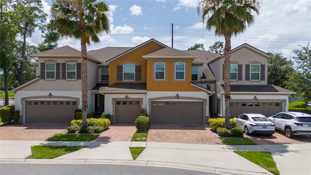 3508 Brighton Park Cir, Belle Isle, FL 32812 - view of front facade featuring a garage, stucco siding, and driveway