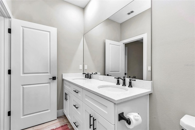 23430 SW Neptune Blvd, Dunnellon, FL 34431 - bathroom featuring double vanity and toilet