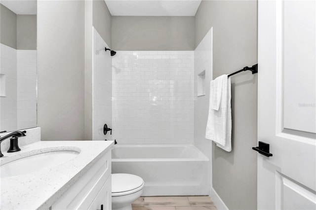 23430 SW Neptune Blvd, Dunnellon, FL 34431 - bathroom with toilet, vanity,  shower combination, and baseboards