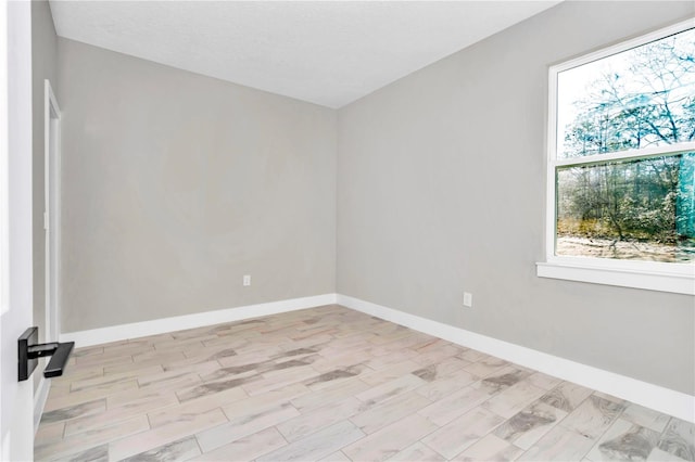 23430 SW Neptune Blvd, Dunnellon, FL 34431 - spare room featuring baseboards and wood finished floors