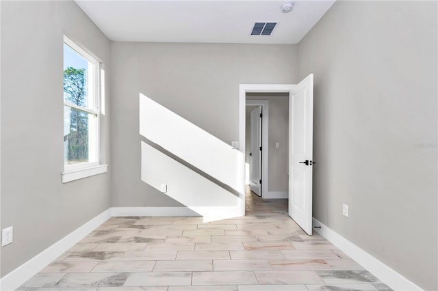 23430 SW Neptune Blvd, Dunnellon, FL 34431 - empty room featuring baseboards and a smoke detector