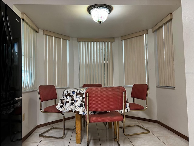 2765 Montego Bay Blvd, Kissimmee, FL 34746 - tiled dining area featuring baseboards
