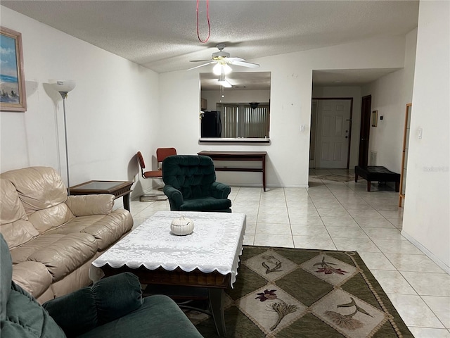 2765 Montego Bay Blvd, Kissimmee, FL 34746 - living area with light tile patterned flooring, a textured ceiling, and ceiling fan