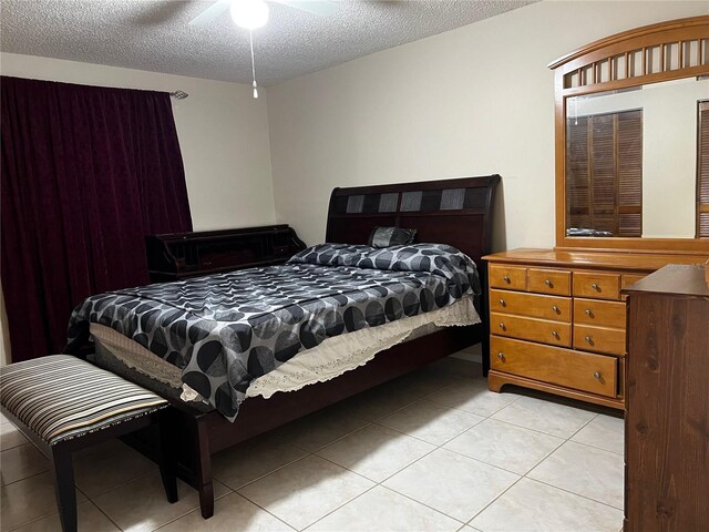 2765 Montego Bay Blvd, Kissimmee, FL 34746 - bedroom featuring light tile patterned floors and a textured ceiling