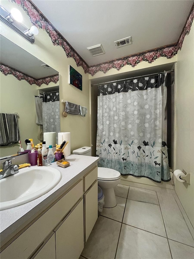 2765 Montego Bay Blvd, Kissimmee, FL 34746 - bathroom featuring vanity, tile patterned floors, and shower / bath combo with shower curtain