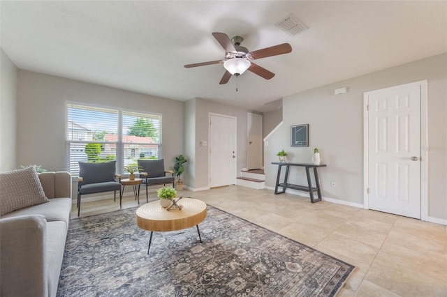 9494 Lake Lotta Cir, Gotha, FL 34734 - living area with ceiling fan, light tile patterned floors, and stairway