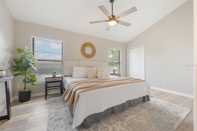 9494 Lake Lotta Cir, Gotha, FL 34734 - bedroom featuring light wood finished floors, vaulted ceiling, and ceiling fan