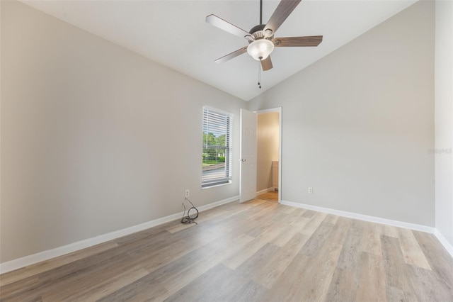 9494 Lake Lotta Cir, Gotha, FL 34734 - empty room featuring vaulted ceiling, ceiling fan, and light wood-type flooring