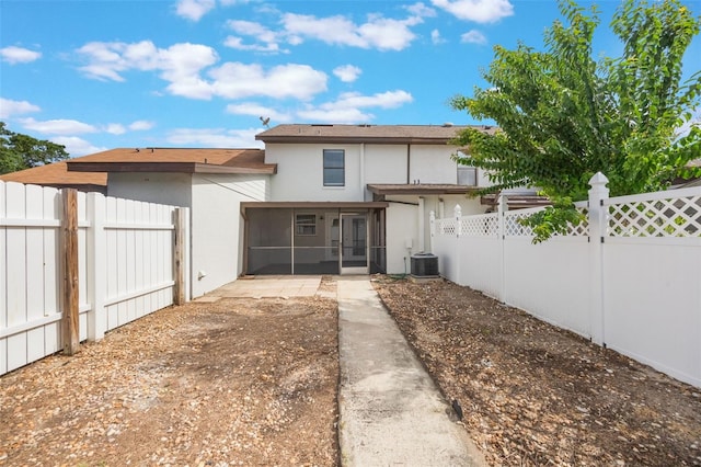 9494 Lake Lotta Cir, Gotha, FL 34734 - rear view of house with stucco siding, a sunroom, and a fenced backyard