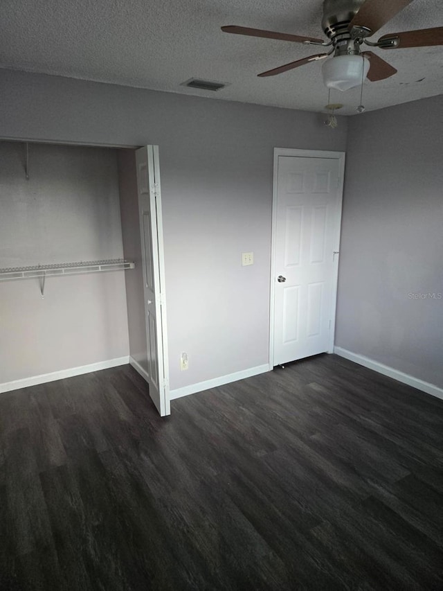 3869 Sienna Greens Ter, Lauderhill, FL 33319 - unfurnished bedroom with dark wood-style floors, a textured ceiling, and a ceiling fan