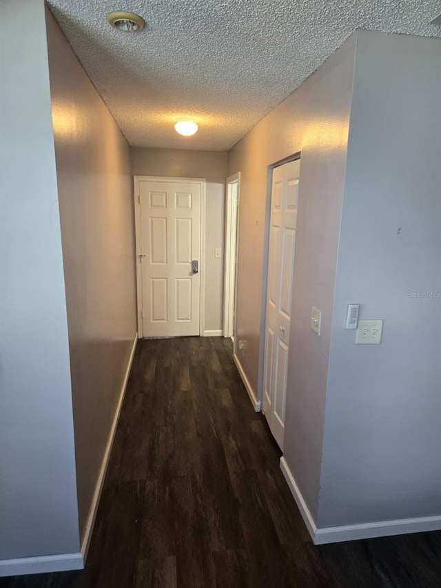 3869 Sienna Greens Ter, Lauderhill, FL 33319 - hallway with dark wood finished floors and a textured ceiling