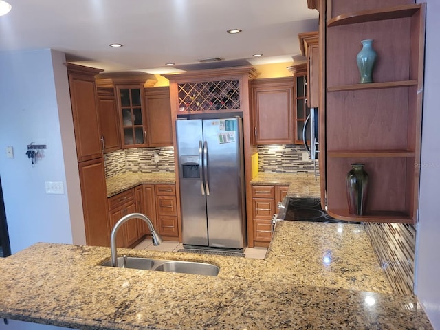 3869 Sienna Greens Ter, Lauderhill, FL 33319 - kitchen featuring appliances with stainless steel finishes, backsplash, light stone counters, recessed lighting, and glass insert cabinets