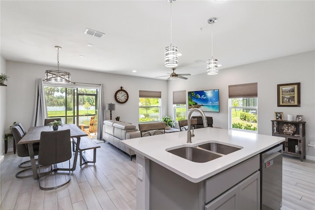 378 Cape Honeysuckle Pl, Sanford, FL 32771 - kitchen with dishwasher, open floor plan, light countertops, healthy amount of natural light, and recessed lighting