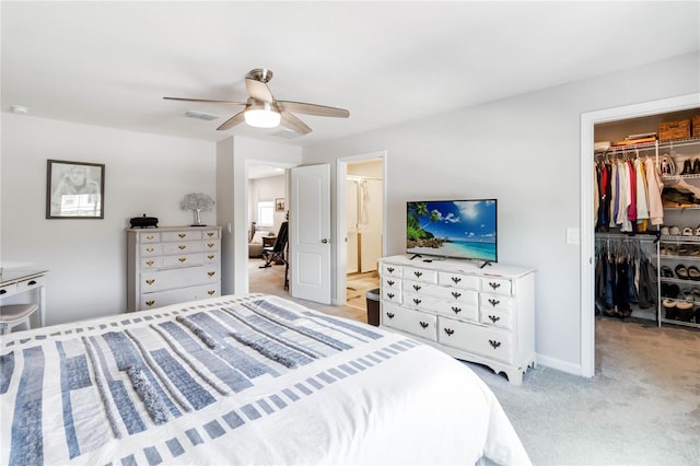378 Cape Honeysuckle Pl, Sanford, FL 32771 - bedroom featuring a spacious closet, a closet, light carpet, a ceiling fan, and ensuite bathroom