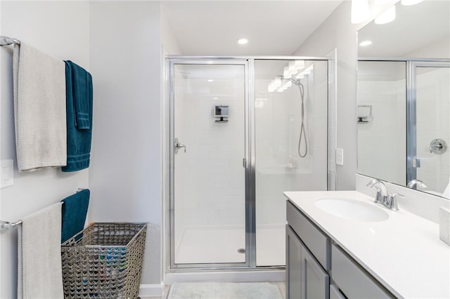 378 Cape Honeysuckle Pl, Sanford, FL 32771 - bathroom featuring vanity, a shower stall, and recessed lighting