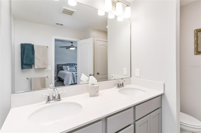 378 Cape Honeysuckle Pl, Sanford, FL 32771 - full bathroom with connected bathroom, double vanity, and a ceiling fan