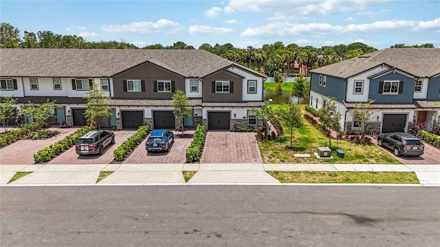 378 Cape Honeysuckle Pl, Sanford, FL 32771 - multi unit property featuring driveway, a garage, a residential view, and stone siding