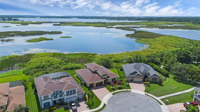 15344 Johns Lake Pointe Blvd, Winter Garden, FL 34787 - aerial view of residential area featuring a nearby body of water and a forest