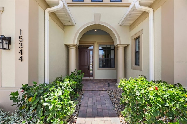 15344 Johns Lake Pointe Blvd, Winter Garden, FL 34787 - doorway to property featuring stucco siding