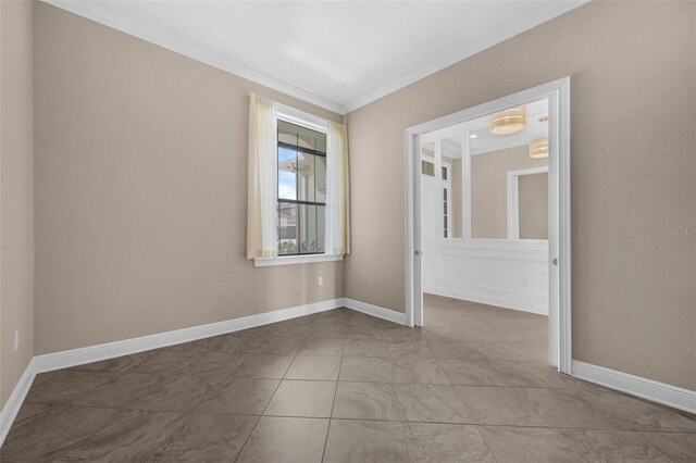 15344 Johns Lake Pointe Blvd, Winter Garden, FL 34787 - spare room featuring ornamental molding and baseboards