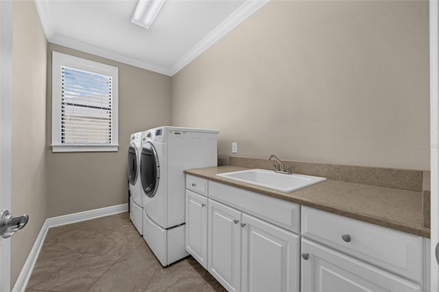 15344 Johns Lake Pointe Blvd, Winter Garden, FL 34787 - laundry room featuring independent washer and dryer, crown molding, cabinet space, and light marble finish flooring