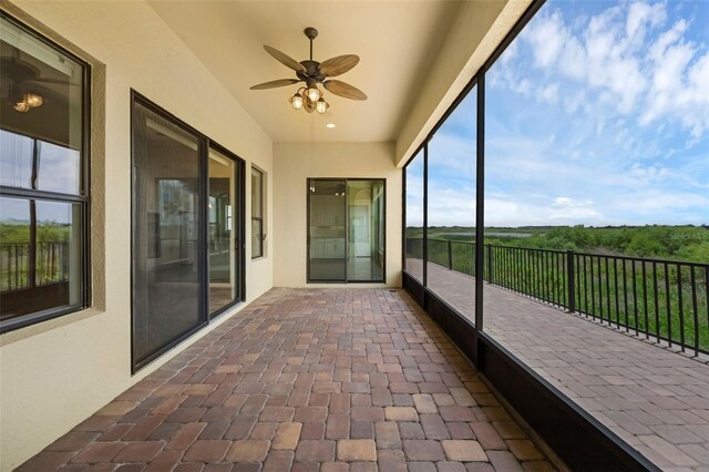 15344 Johns Lake Pointe Blvd, Winter Garden, FL 34787 - unfurnished sunroom featuring ceiling fan