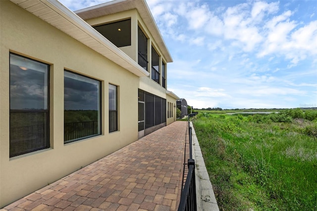 15344 Johns Lake Pointe Blvd, Winter Garden, FL 34787 - view of patio featuring a view of countryside