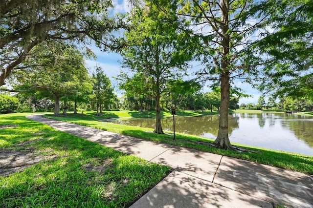 15344 Johns Lake Pointe Blvd, Winter Garden, FL 34787 - surrounding community featuring a water view, a lawn, and view of scattered trees