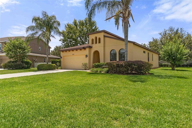 3637 Foxchase Dr, Clermont, FL 34711 - mediterranean / spanish home featuring stucco siding, a garage, driveway, and a front lawn