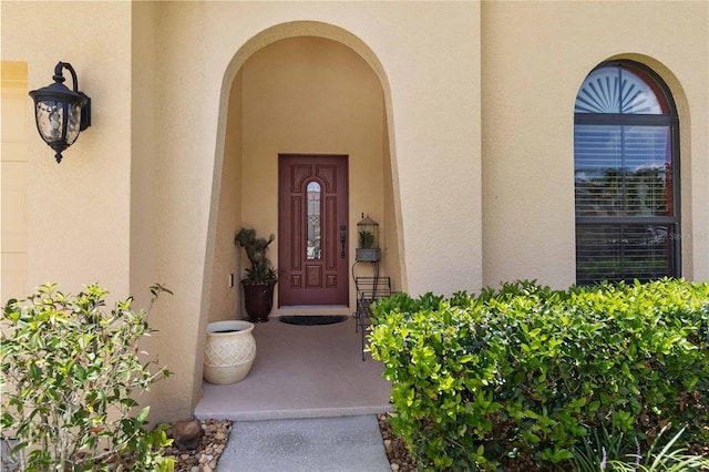 3637 Foxchase Dr, Clermont, FL 34711 - view of exterior entry with stucco siding