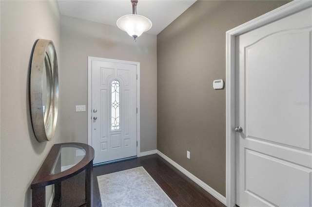 3637 Foxchase Dr, Clermont, FL 34711 - foyer entrance featuring dark wood finished floors and baseboards