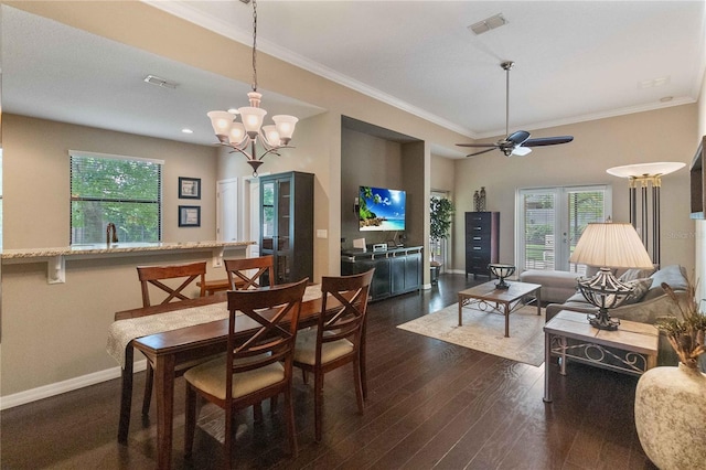 3637 Foxchase Dr, Clermont, FL 34711 - dining space featuring ornamental molding, healthy amount of natural light, dark wood-style flooring, ceiling fan, and a chandelier