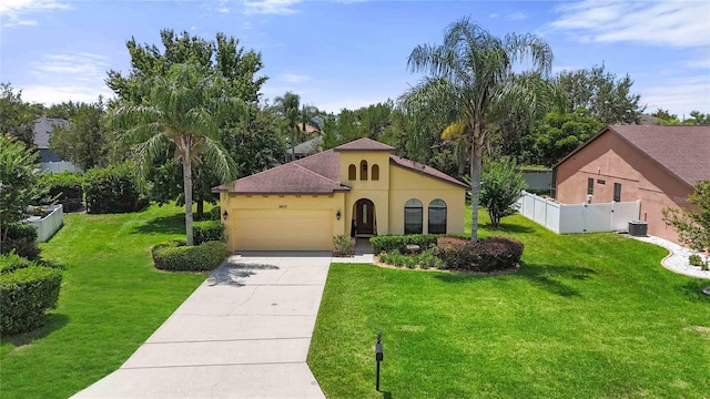 3637 Foxchase Dr, Clermont, FL 34711 - mediterranean / spanish house with stucco siding, a garage, and concrete driveway