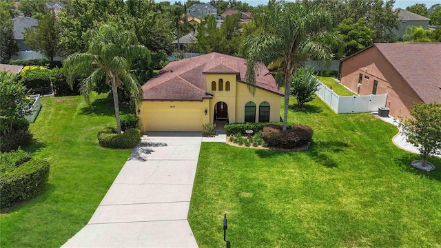 3637 Foxchase Dr, Clermont, FL 34711 - view of front facade featuring a garage, stucco siding, and concrete driveway