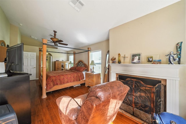 742 Seneca Trl, Saint Cloud, FL 34772 - bedroom with a fireplace, vaulted ceiling, wood finished floors, and ceiling fan