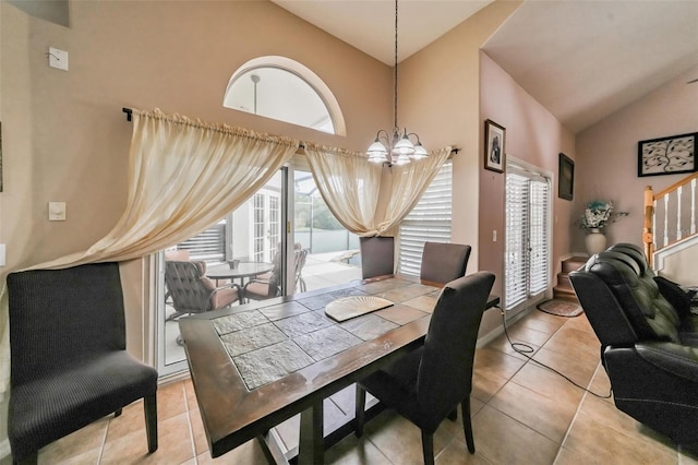 742 Seneca Trl, Saint Cloud, FL 34772 - dining area featuring a chandelier, light tile patterned flooring, high vaulted ceiling, and stairway