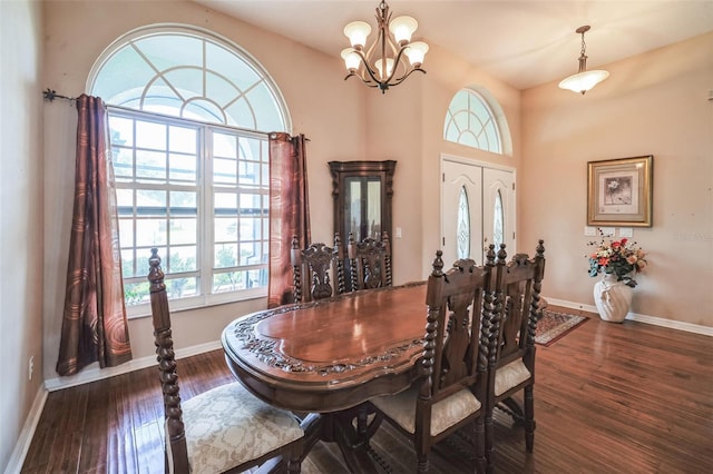 742 Seneca Trl, Saint Cloud, FL 34772 - dining space featuring a chandelier, wood finished floors, and baseboards