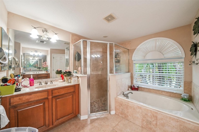 742 Seneca Trl, Saint Cloud, FL 34772 - full bathroom with vanity, a bath, a stall shower, and tile patterned flooring
